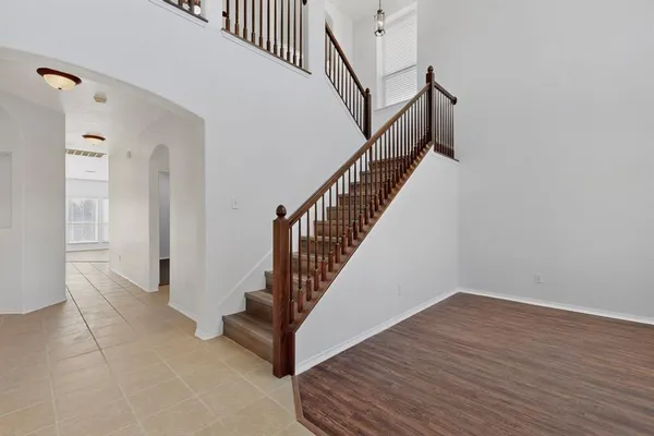 a kitchen with stainless steel appliances granite countertop a refrigerator sink and stove