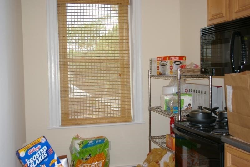 12 Ransom Road, Unit 6 Boston, MA 02135 - Photo 8 of 16 a view of a workspace with furniture and a window