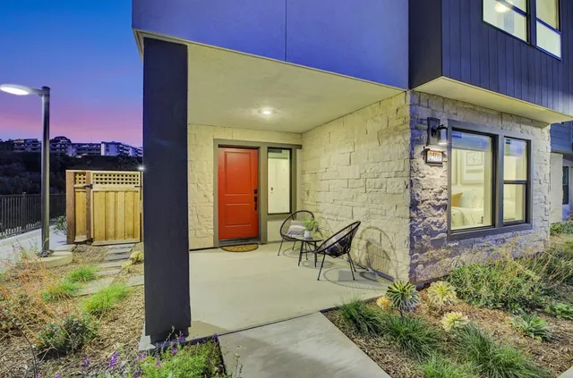 a view of a garden with an outdoor seating