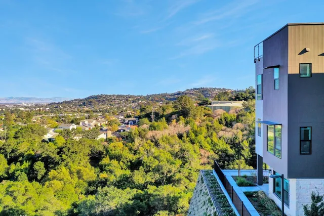 a spacious bedroom with a bed and a window