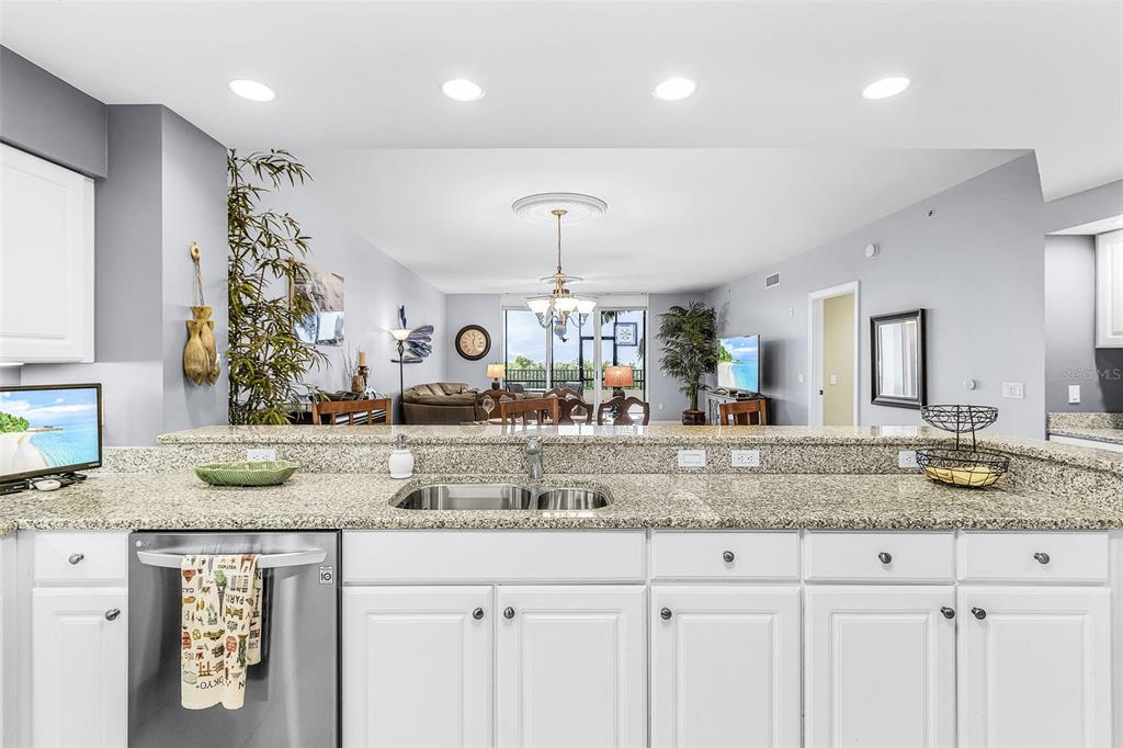 3333 Sunset Key Circle, Unit 103 Punta Gorda, FL 33955 - Photo 21 of 58 a view living room with granite countertop kitchen island white cabinets and a granite counter tops