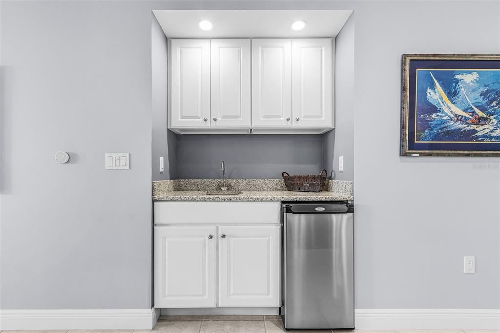3333 Sunset Key Circle, Unit 103 Punta Gorda, FL 33955 - Photo 22 of 58 a kitchen with stainless steel appliances granite countertop white cabinets and a stove
