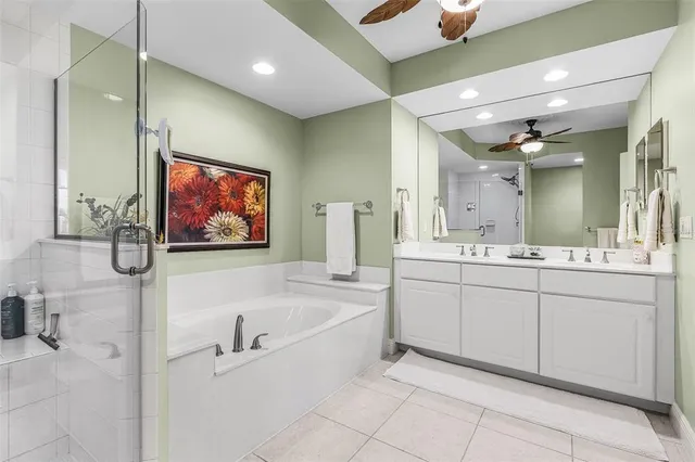 a spacious bedroom with a bed and a window