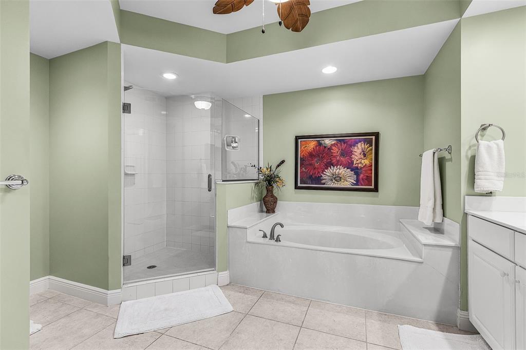 3333 Sunset Key Circle, Unit 103 Punta Gorda, FL 33955 - Photo 27 of 58 a spacious bathroom with a tub a shower and a sink