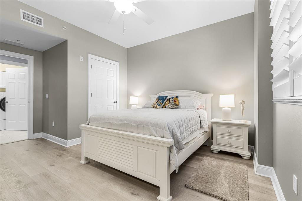 3333 Sunset Key Circle, Unit 103 Punta Gorda, FL 33955 - Photo 30 of 58 a spacious bedroom with a bed and a window