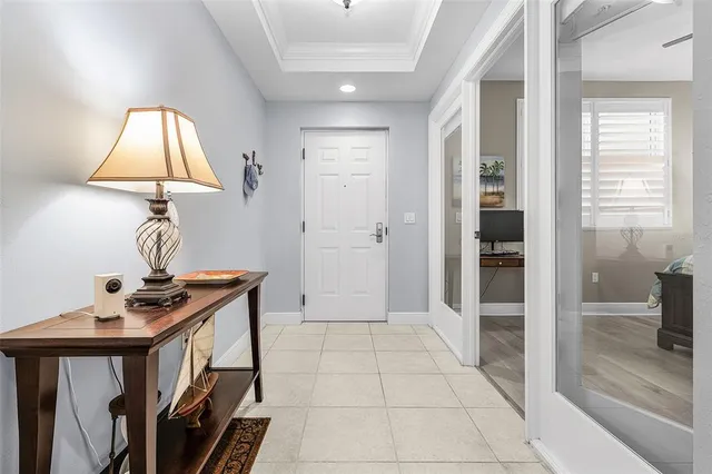 a view of a hallway with entryway wooden floor and front door