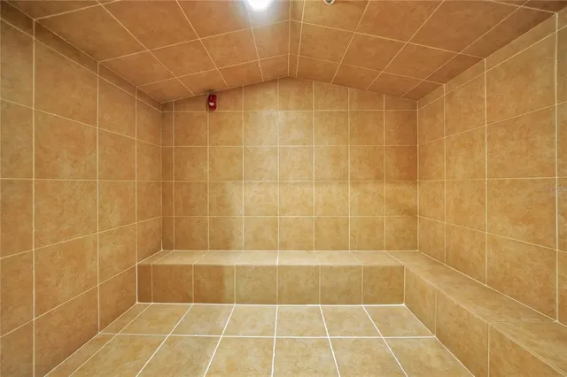 a view of a swimming pool with an outdoor seating