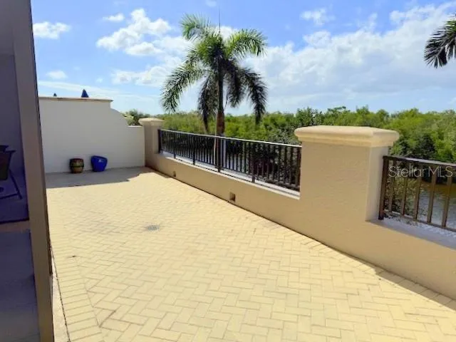 a view of balcony and yard