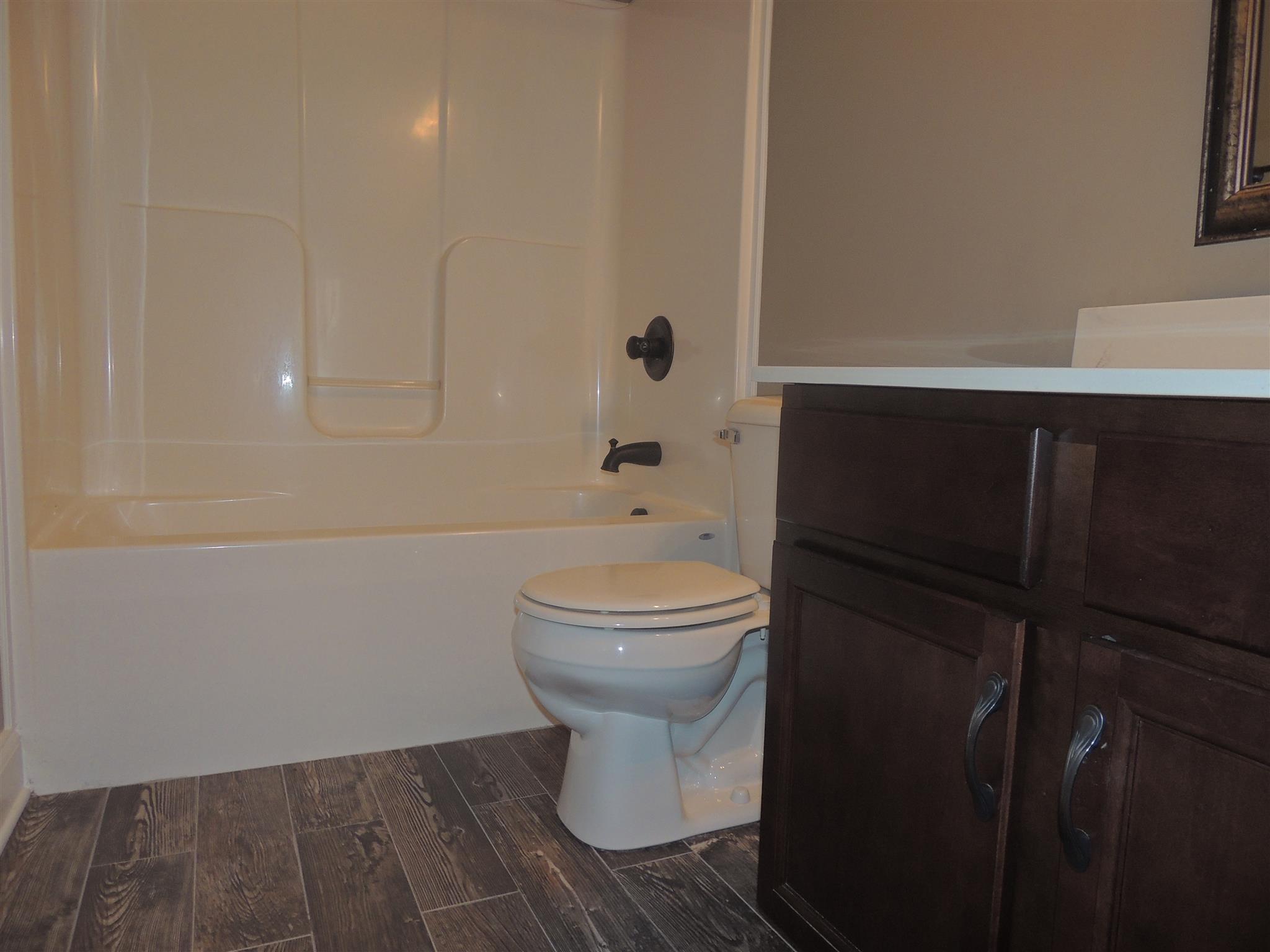 3172 Marthas Chapel Road Cunningham, TN 37052 - Photo 26 of 29 a bathroom with a toilet and a sink