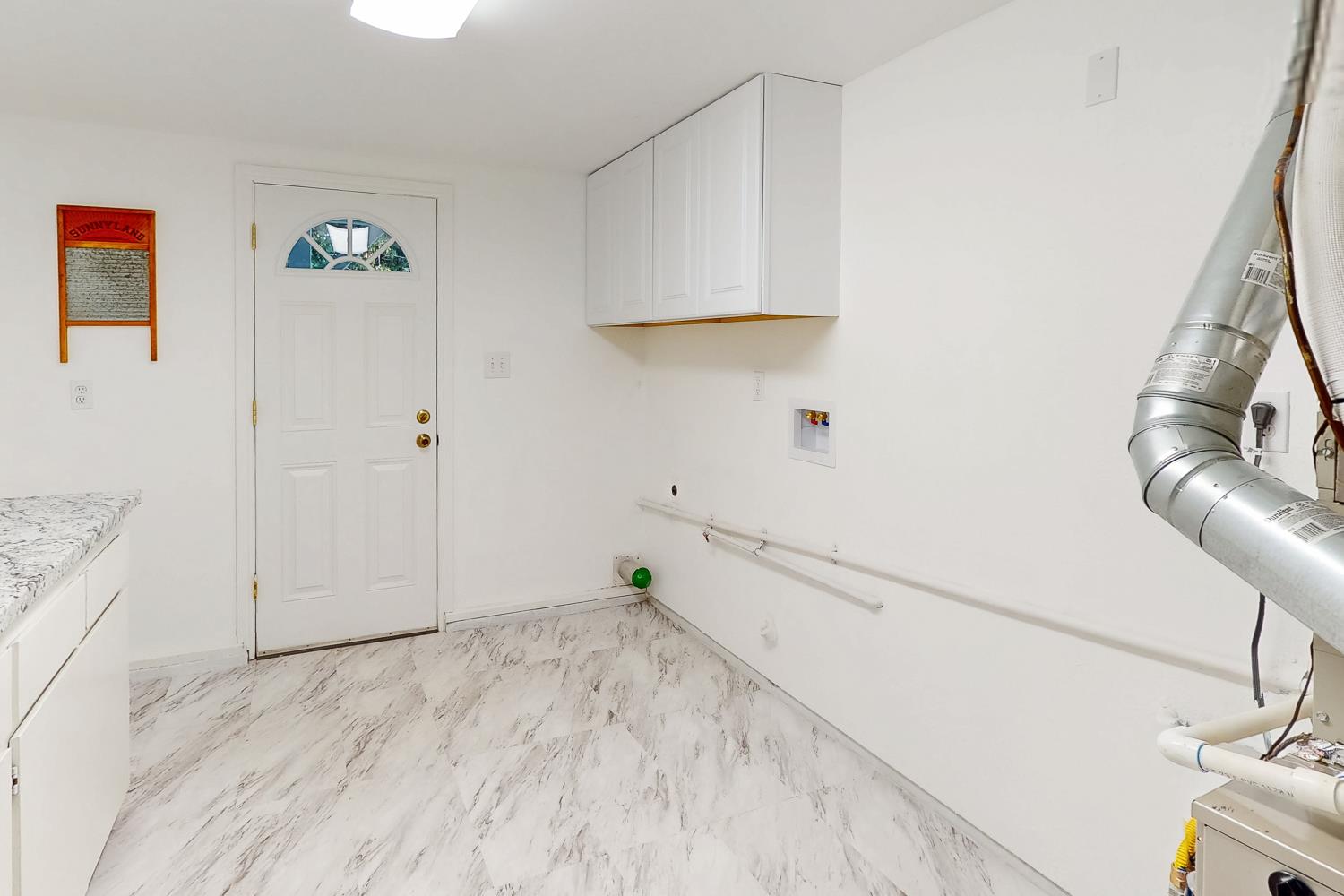 24713 Oro Valley Road Auburn, CA 95602 - Photo 36 of 69 Large Laundry room with outside access