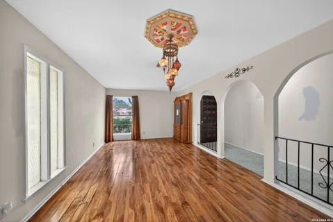 a view of a livingroom with wooden floor