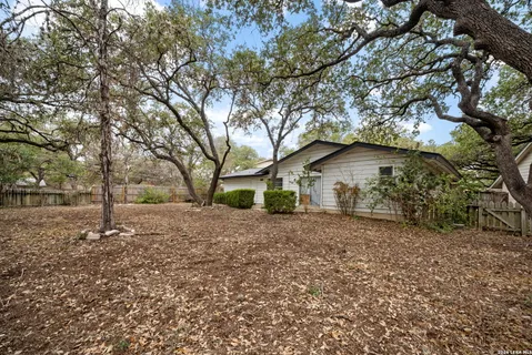 a house with trees in the background