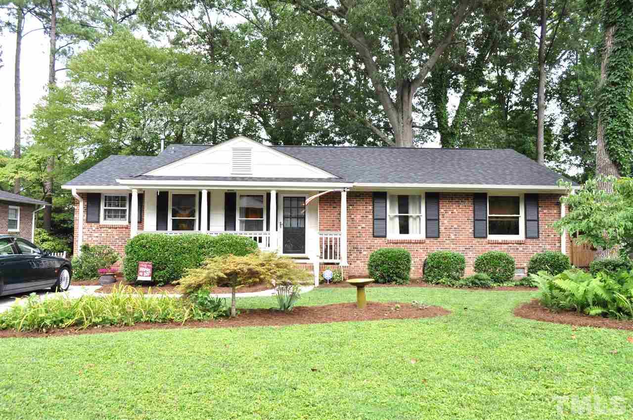 4908 Auburn Road Raleigh, NC 27609 - Photo 1 of 25 a front view of a house with a yard and outdoor seating