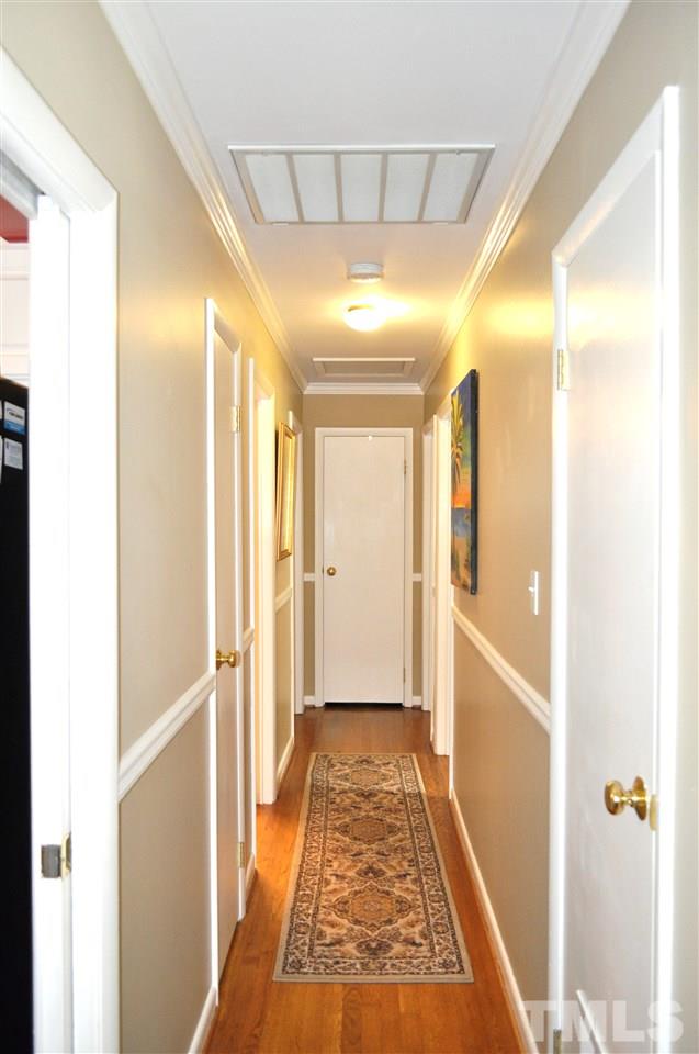 4908 Auburn Road Raleigh, NC 27609 - Photo 16 of 25 a view of hallway with furniture and a window