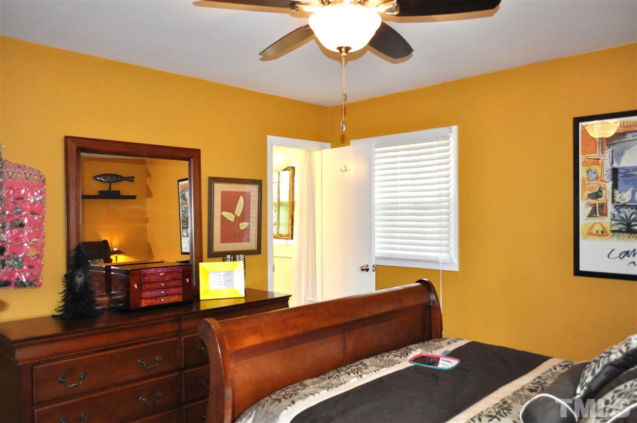 4908 Auburn Road Raleigh, NC 27609 - Photo 19 of 25 a living room with furniture and a window