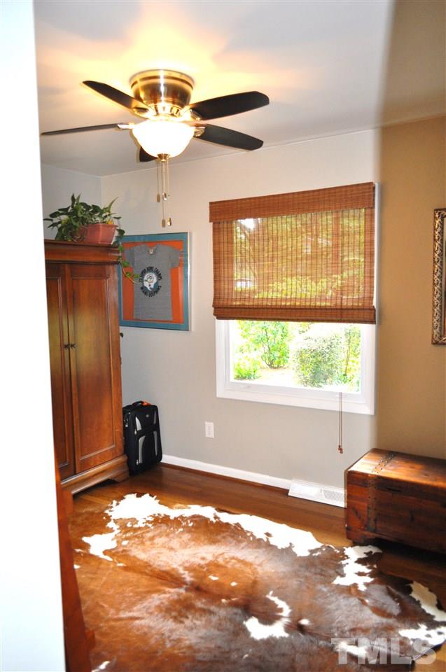 4908 Auburn Road Raleigh, NC 27609 - Photo 21 of 25 a view of a livingroom with a dishwasher and furniture