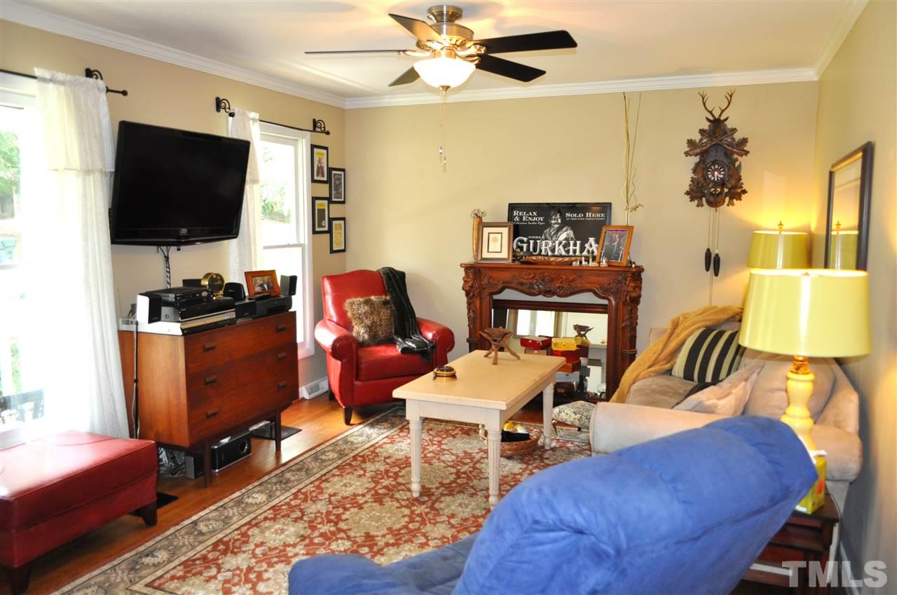 4908 Auburn Road Raleigh, NC 27609 - Photo 6 of 25 a living room with furniture and a flat screen tv