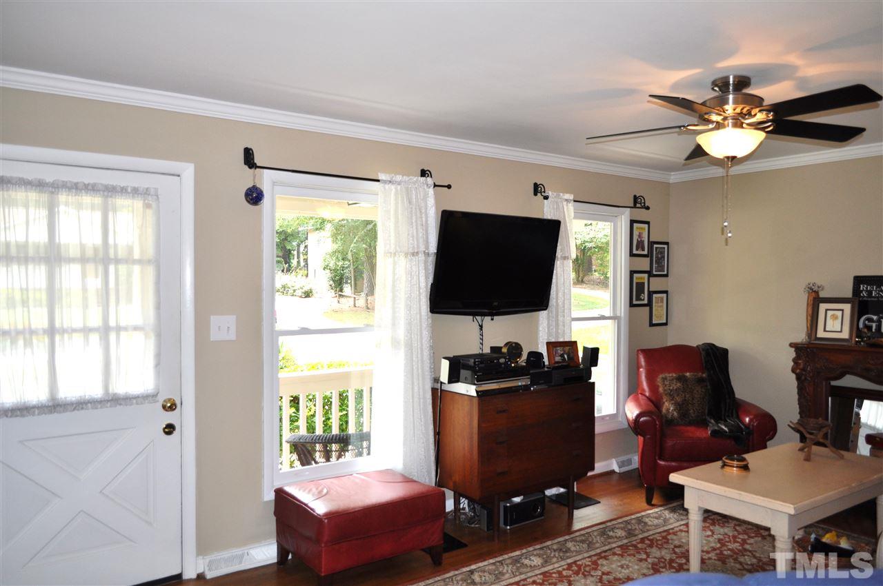 4908 Auburn Road Raleigh, NC 27609 - Photo 7 of 25 a living room with furniture and a flat screen tv