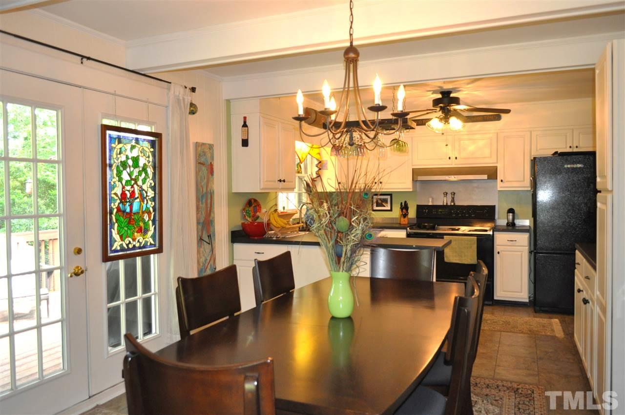 4908 Auburn Road Raleigh, NC 27609 - Photo 8 of 25 a view of a dining room with furniture window and outside view