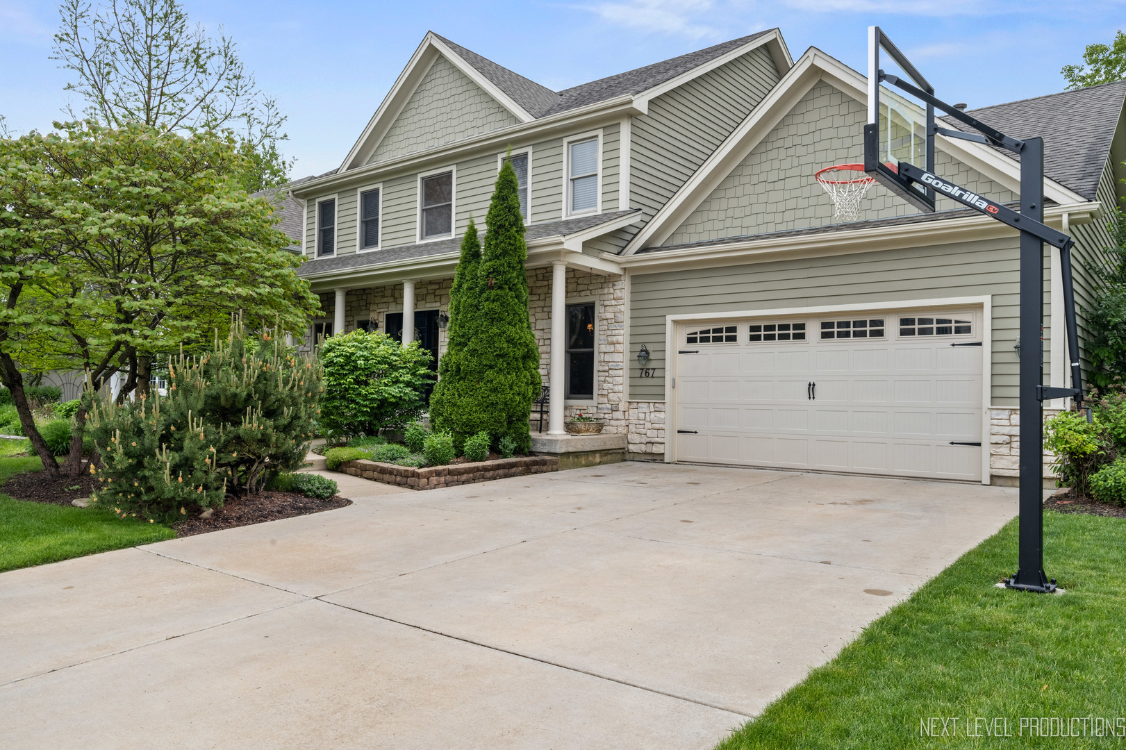 767 Wild Ginger Road Sugar Grove, IL 60554 - Photo 1 of 23 a view of a white house with a small yard and a large window