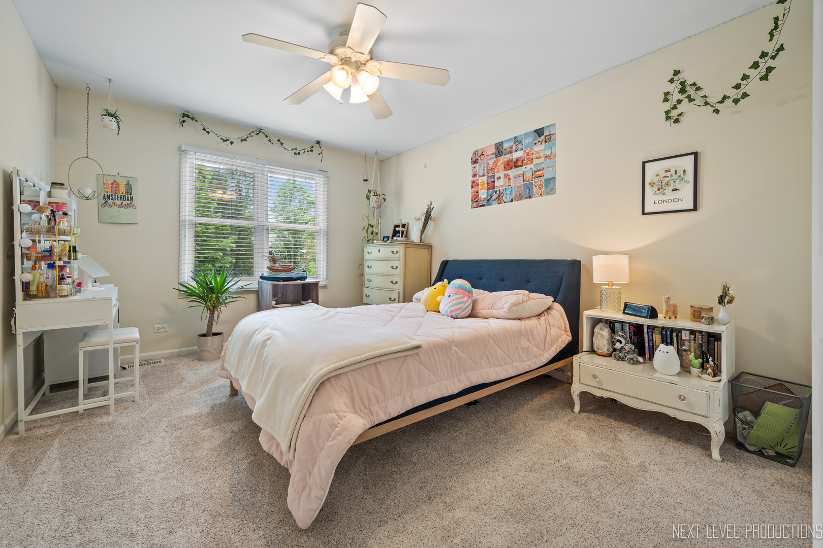 767 Wild Ginger Road Sugar Grove, IL 60554 - Photo 16 of 23 a spacious bedroom with a bed a couch and a window
