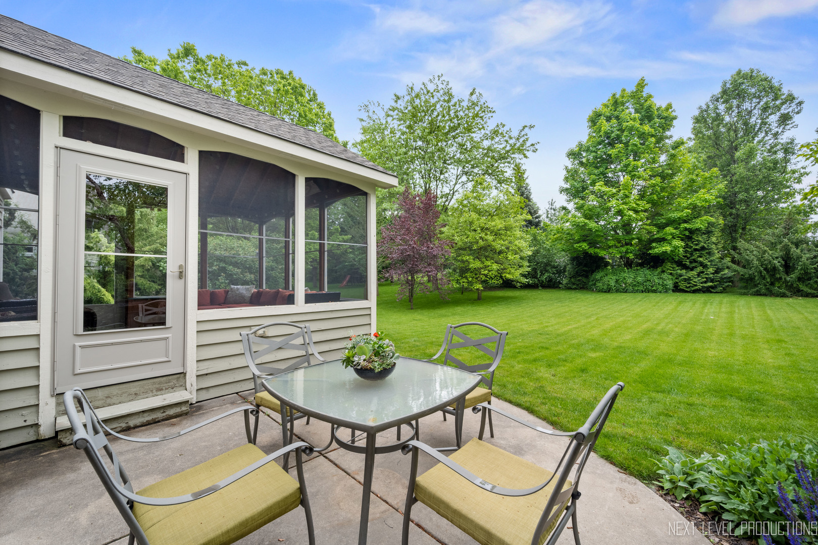 767 Wild Ginger Road Sugar Grove, IL 60554 - Photo 23 of 23 a view of a patio with a table chairs and a table