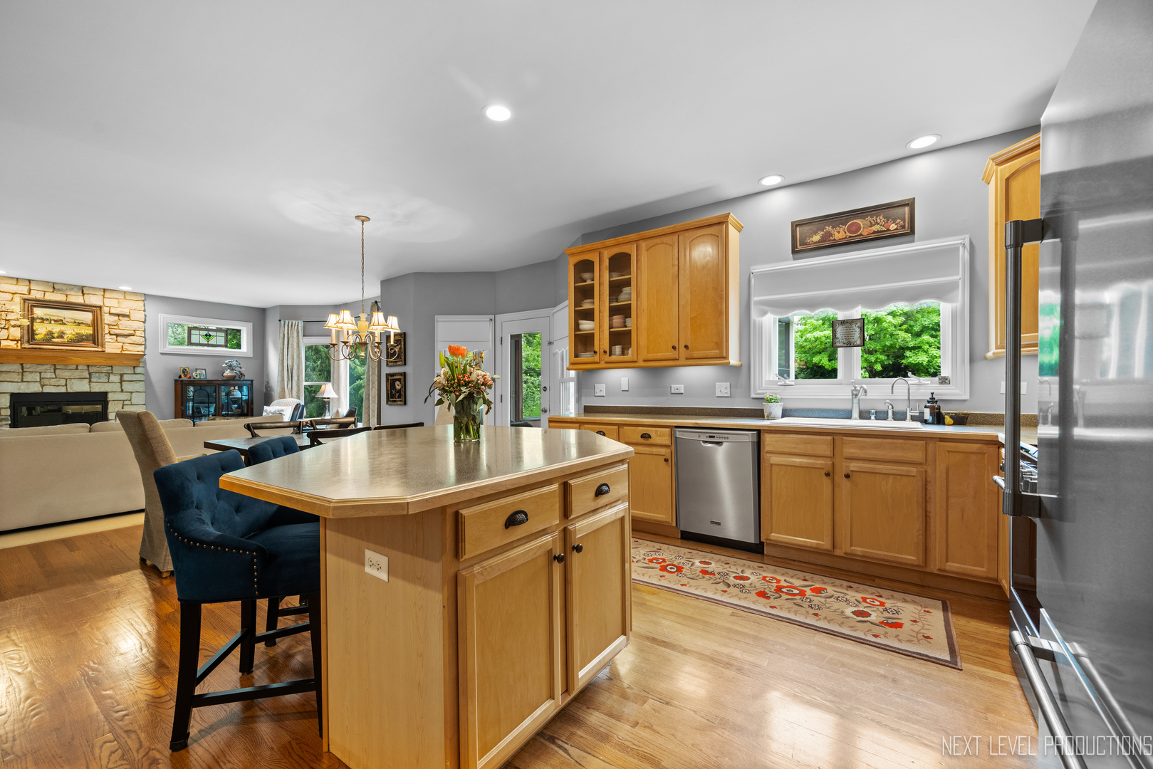 767 Wild Ginger Road Sugar Grove, IL 60554 - Photo 7 of 23 a kitchen with stainless steel appliances granite countertop a sink and a refrigerator