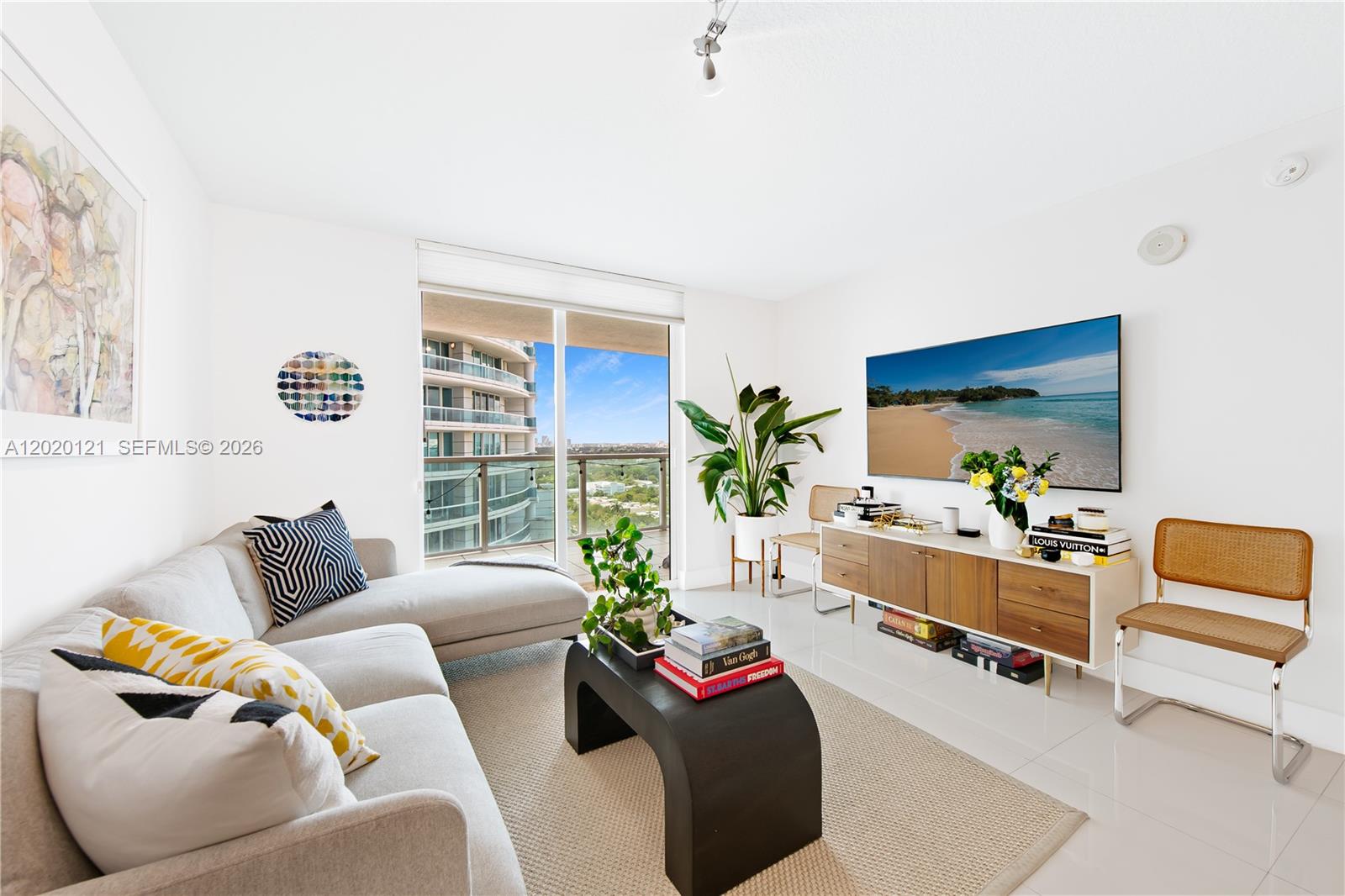 2101 Brickell Avenue, Unit 1909 Miami, FL 33129 - Photo 3 of 25 a living room with furniture and a couch
