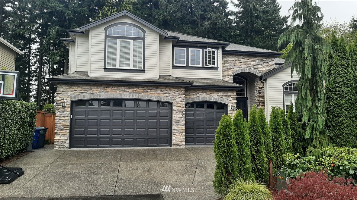 22530 5th Place West Bothell, WA 98021 - Photo 1 of 1 a front view of a house with a yard and garage