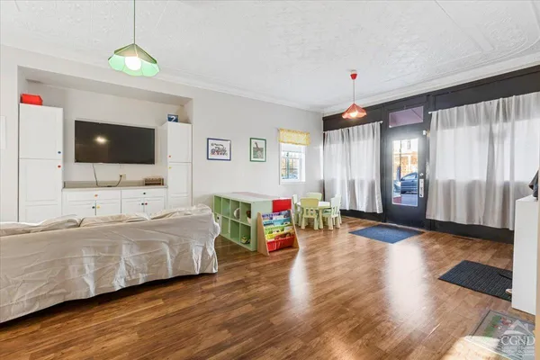 a living room with furniture and a flat screen tv