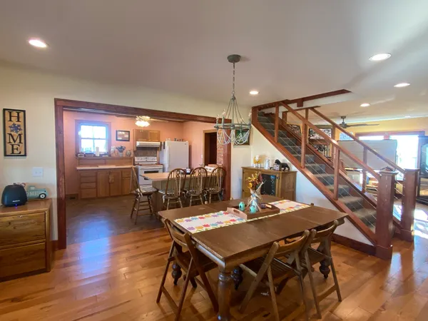 a living room with furniture and wooden floors