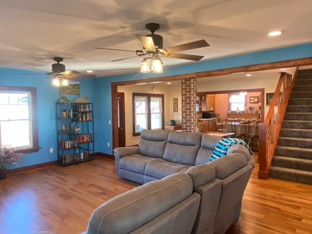 a kitchen with a window a sink and cabinets