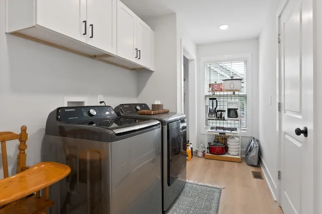 a utility room with closet dryer and washer