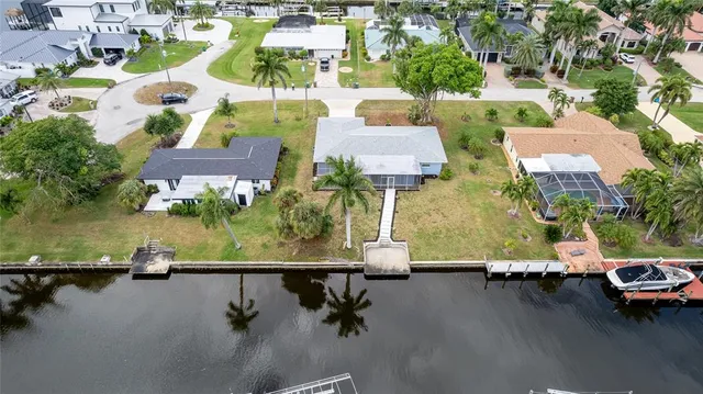 an aerial view of a house with a lake view