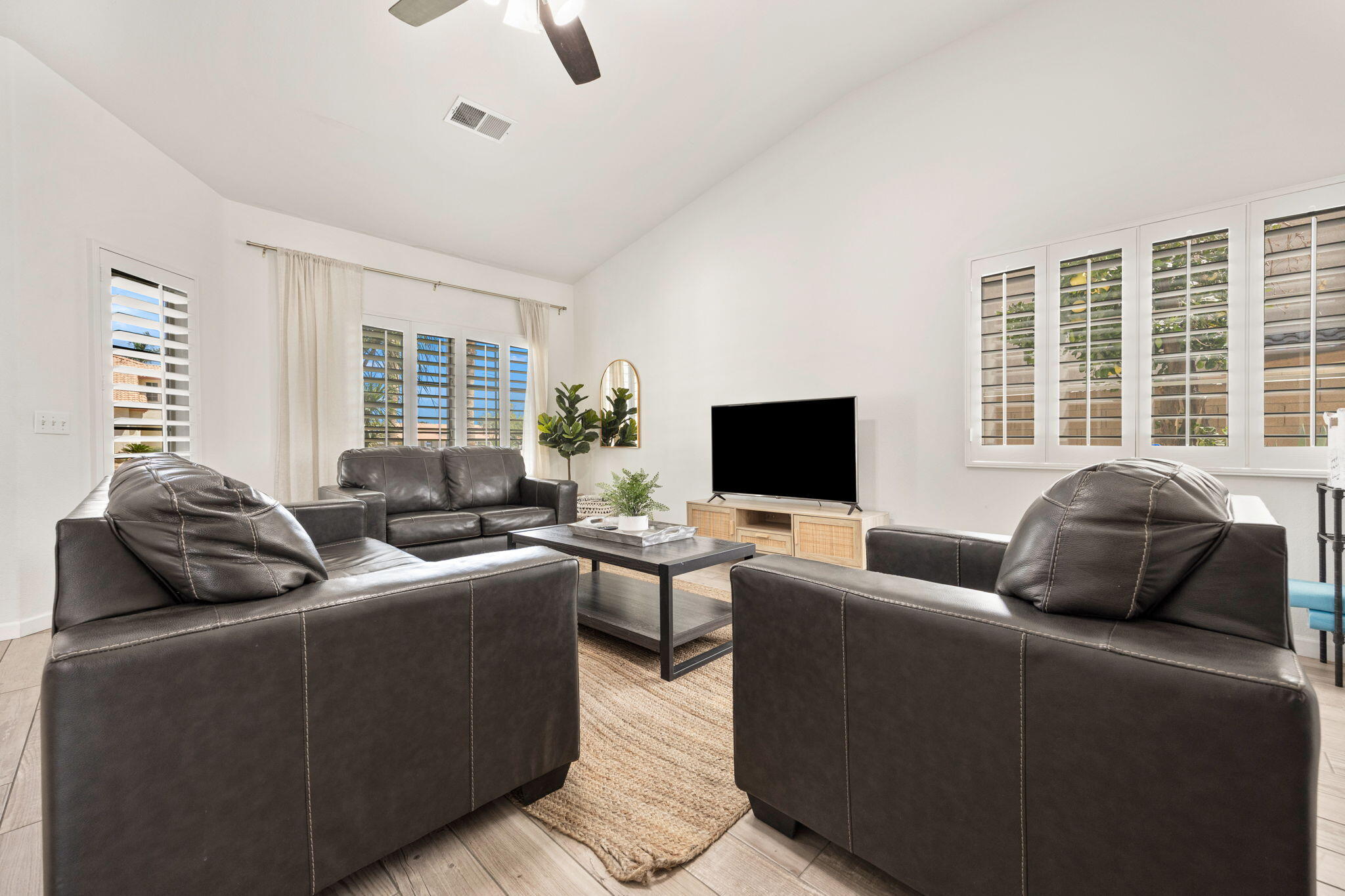 48701 Gibraltar Street Indio, CA 92201 - Photo 12 of 52 a living room with furniture and a flat screen tv
