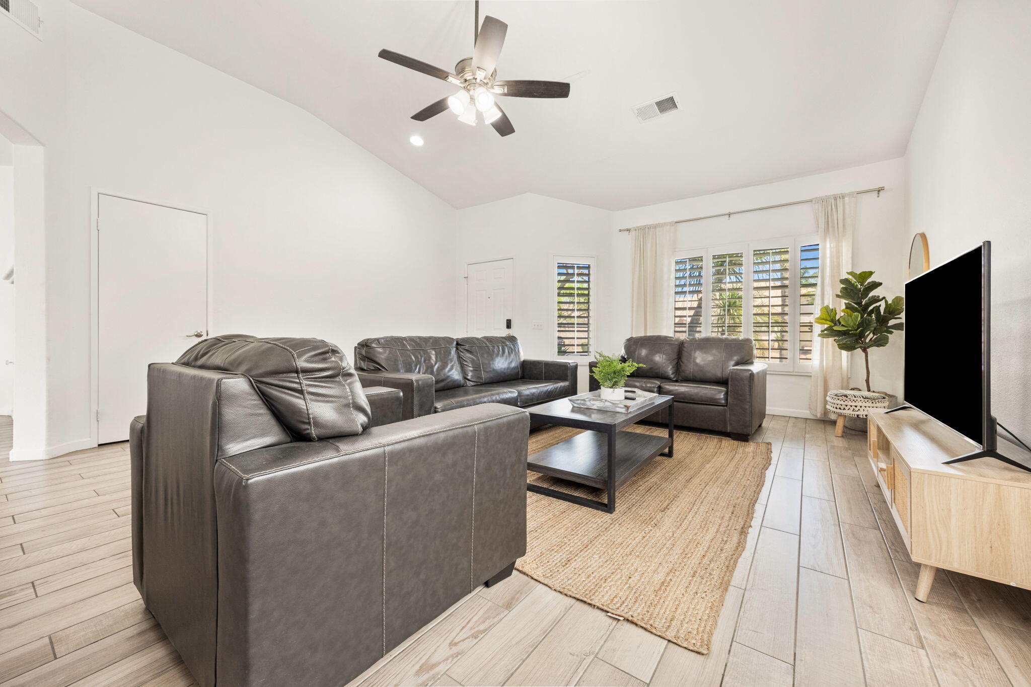 48701 Gibraltar Street Indio, CA 92201 - Photo 14 of 52 a living room with furniture and a flat screen tv