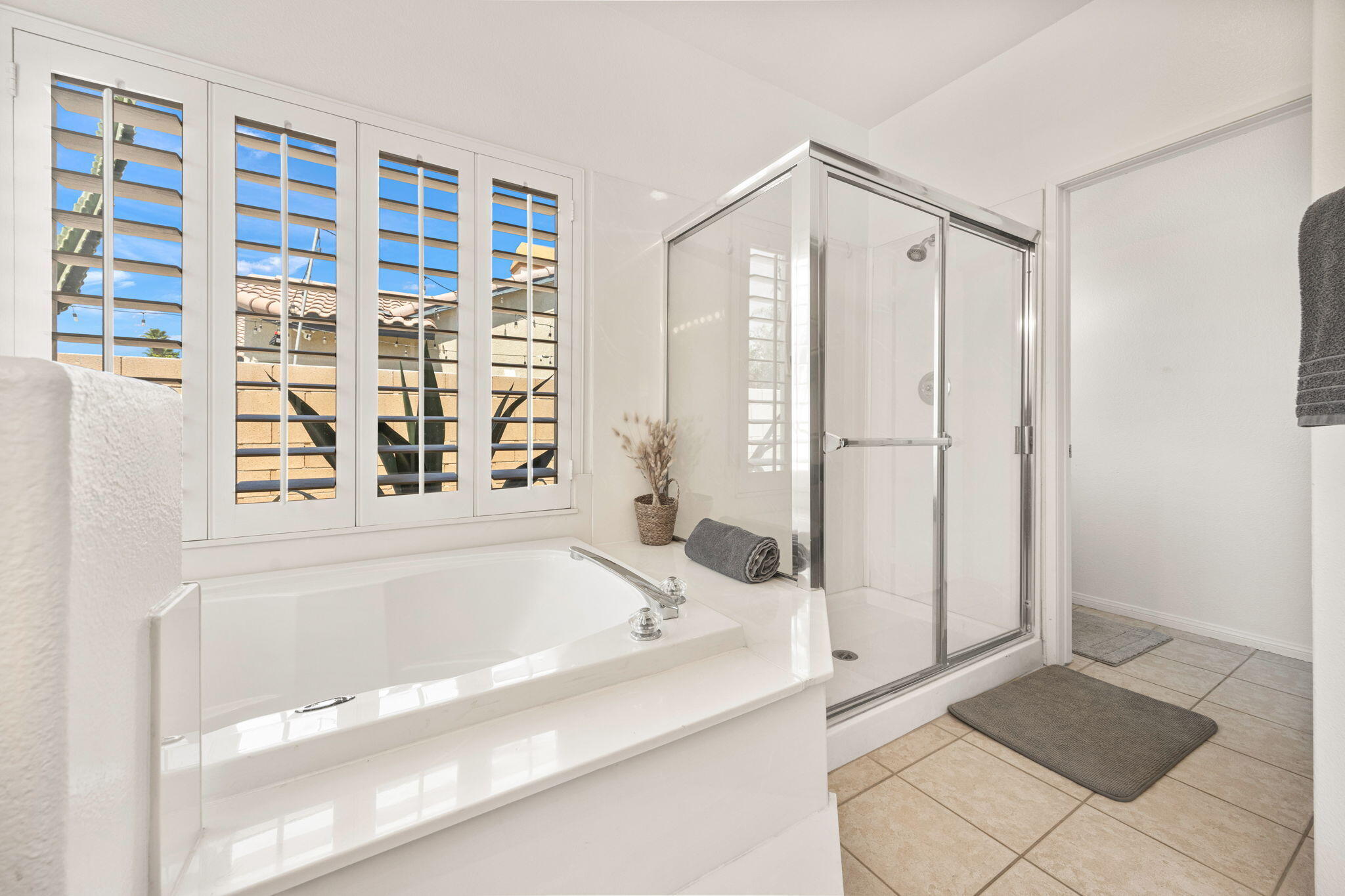 48701 Gibraltar Street Indio, CA 92201 - Photo 22 of 52 a bathroom with a bathtub and a shower