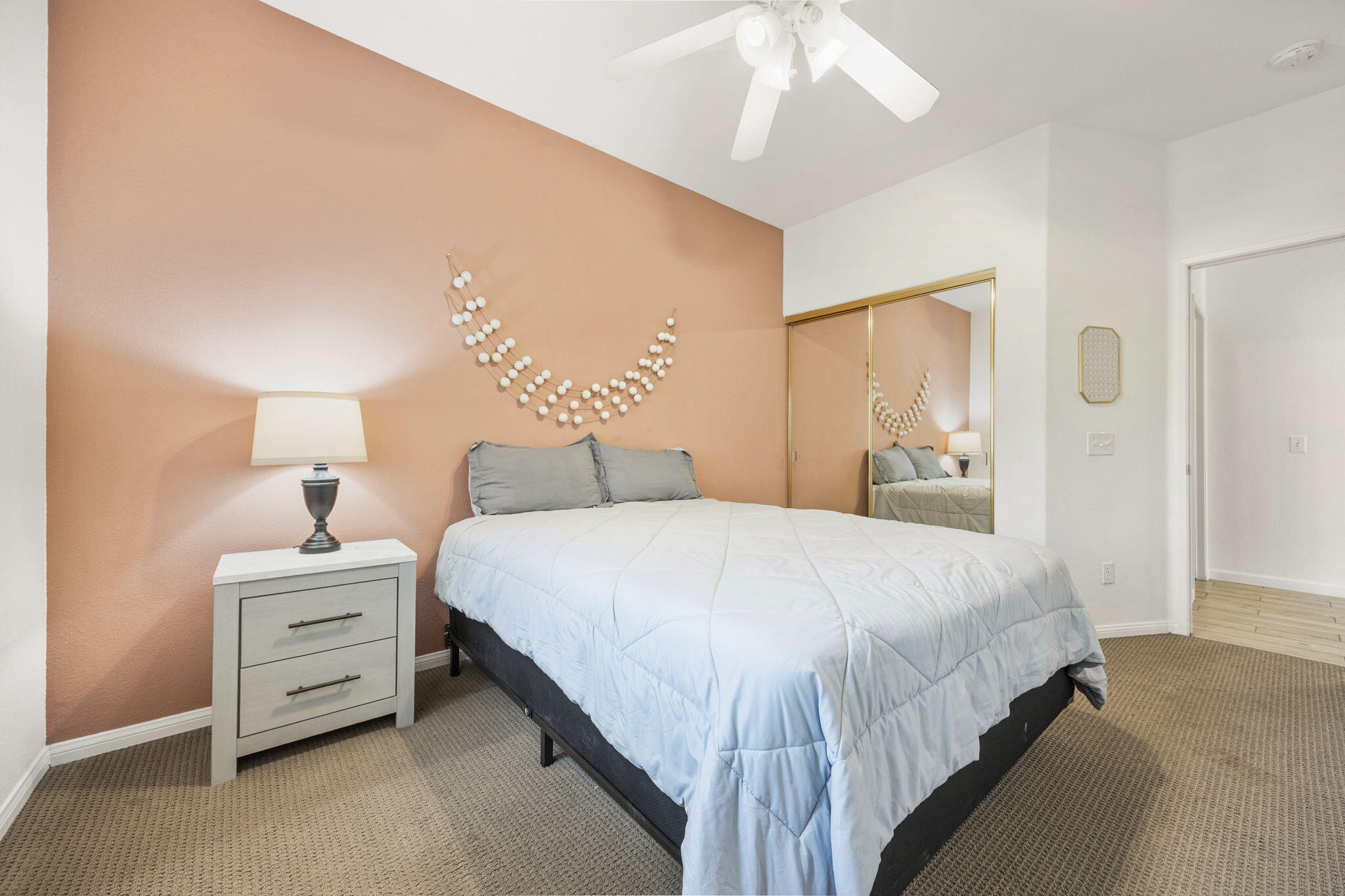 48701 Gibraltar Street Indio, CA 92201 - Photo 25 of 52 a bedroom with a bed and a night stand