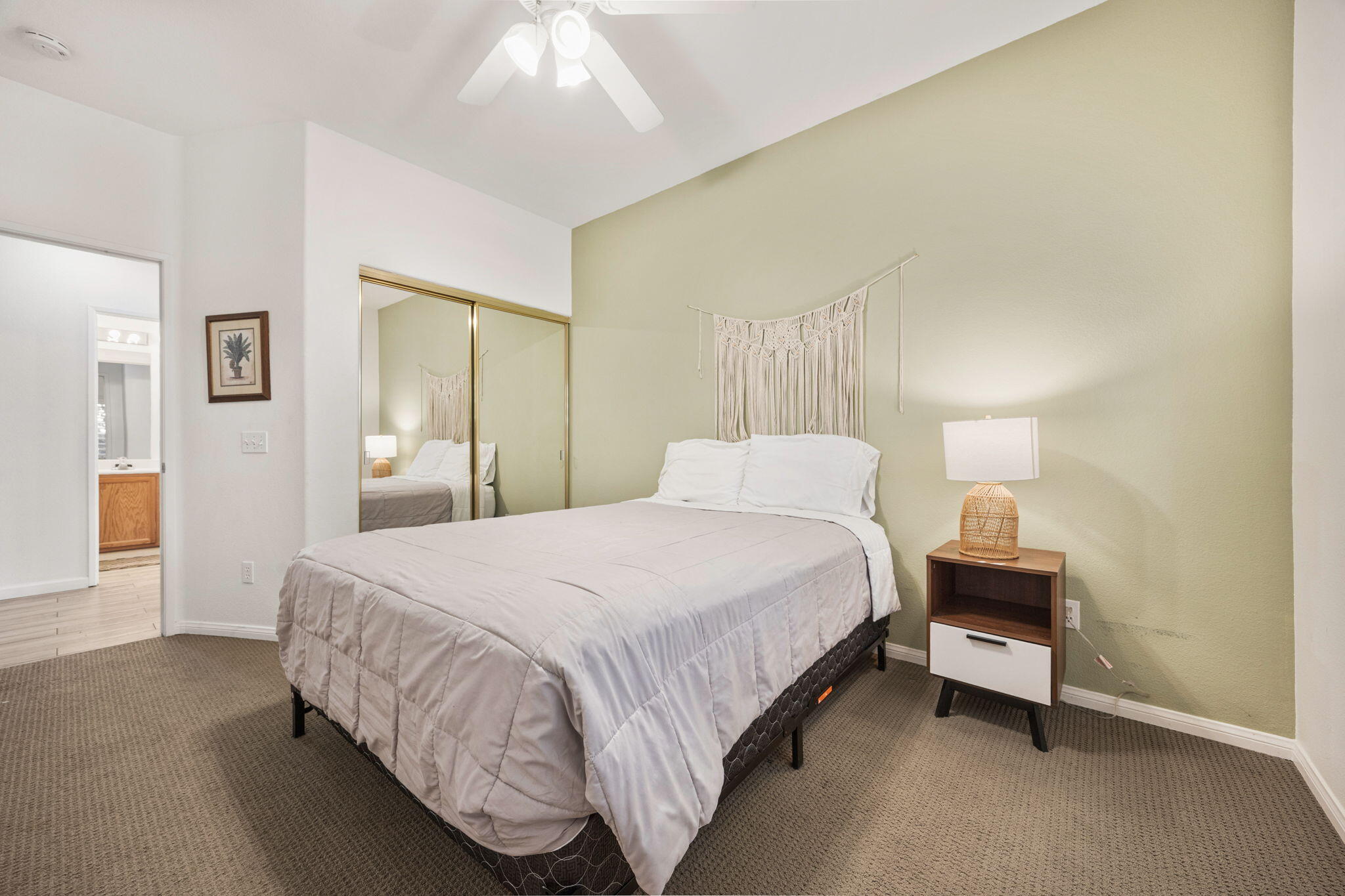48701 Gibraltar Street Indio, CA 92201 - Photo 28 of 52 a bedroom with a bed and a lamp