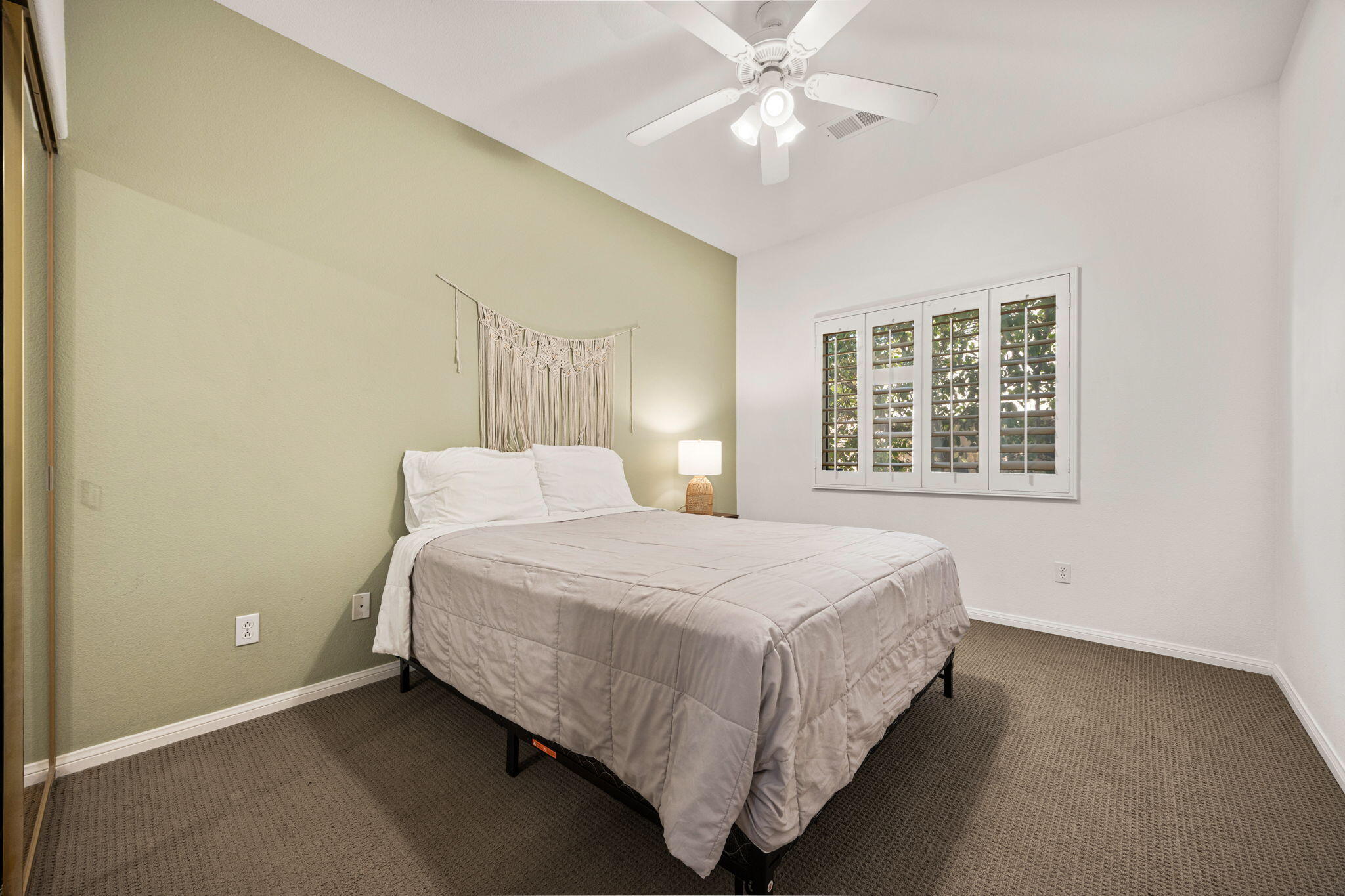 48701 Gibraltar Street Indio, CA 92201 - Photo 29 of 52 a bedroom with a bed and a window