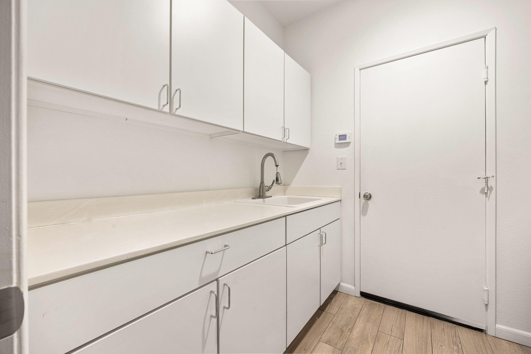 48701 Gibraltar Street Indio, CA 92201 - Photo 32 of 52 a kitchen with a sink and cabinets