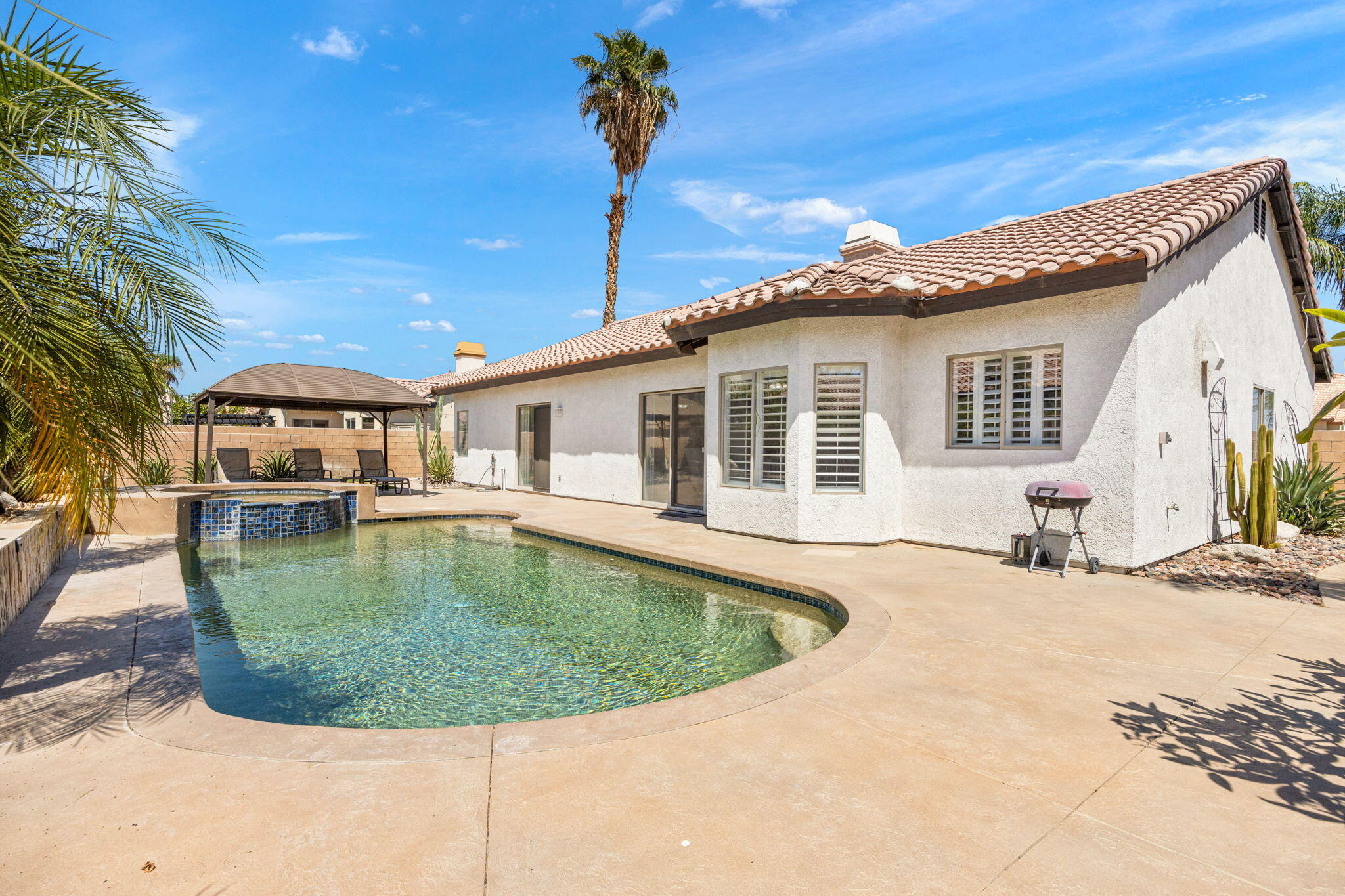 48701 Gibraltar Street Indio, CA 92201 - Photo 38 of 52 a view of a house with a swimming pool