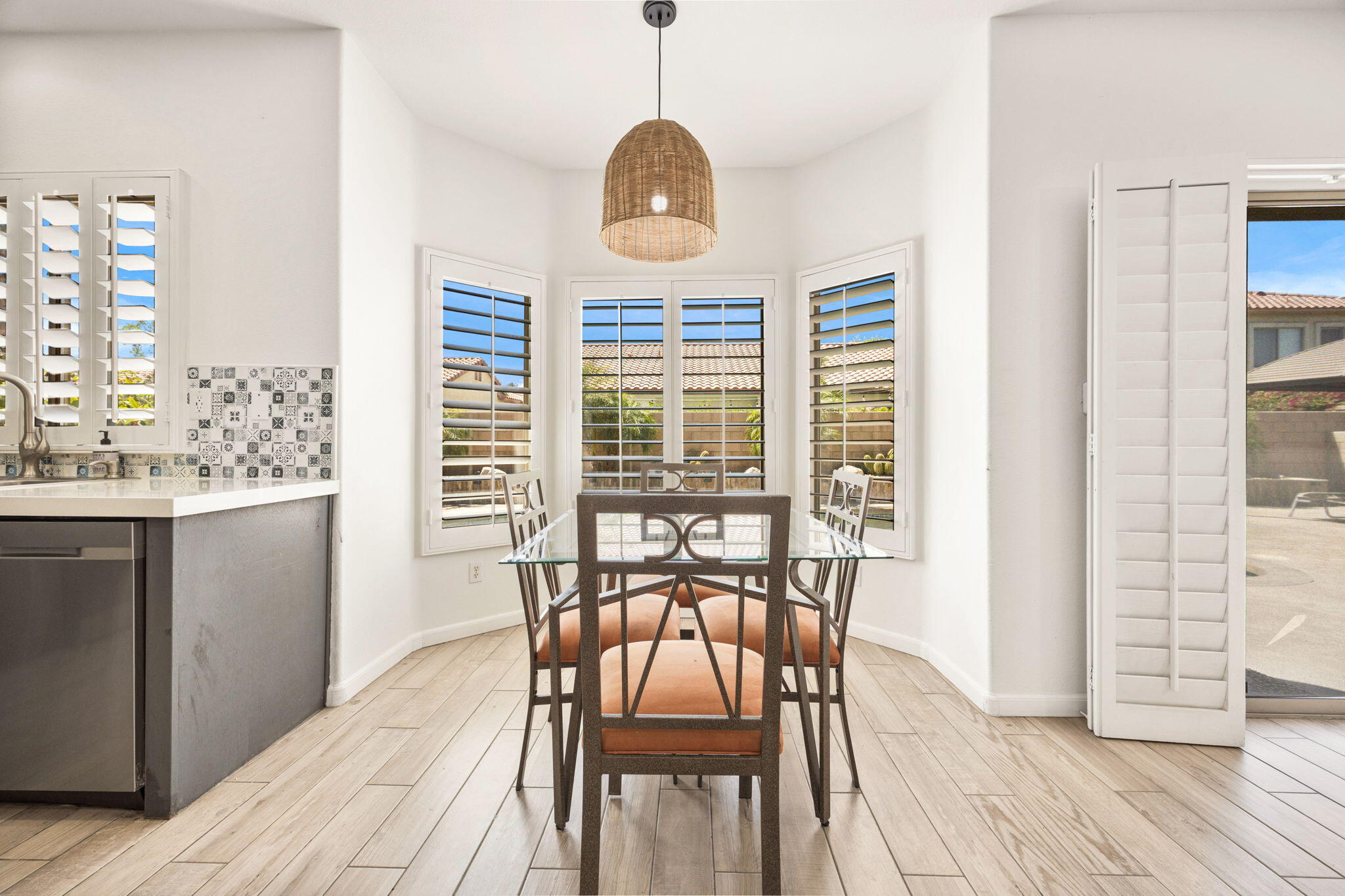 48701 Gibraltar Street Indio, CA 92201 - Photo 6 of 52 a view of a dining room with furniture window and wooden floor