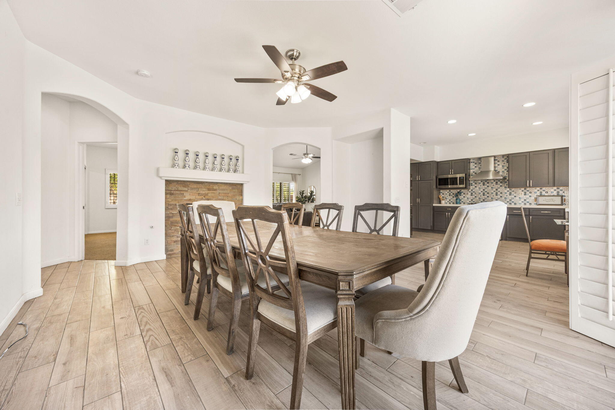 48701 Gibraltar Street Indio, CA 92201 - Photo 7 of 52 a dining room with furniture and wooden floor