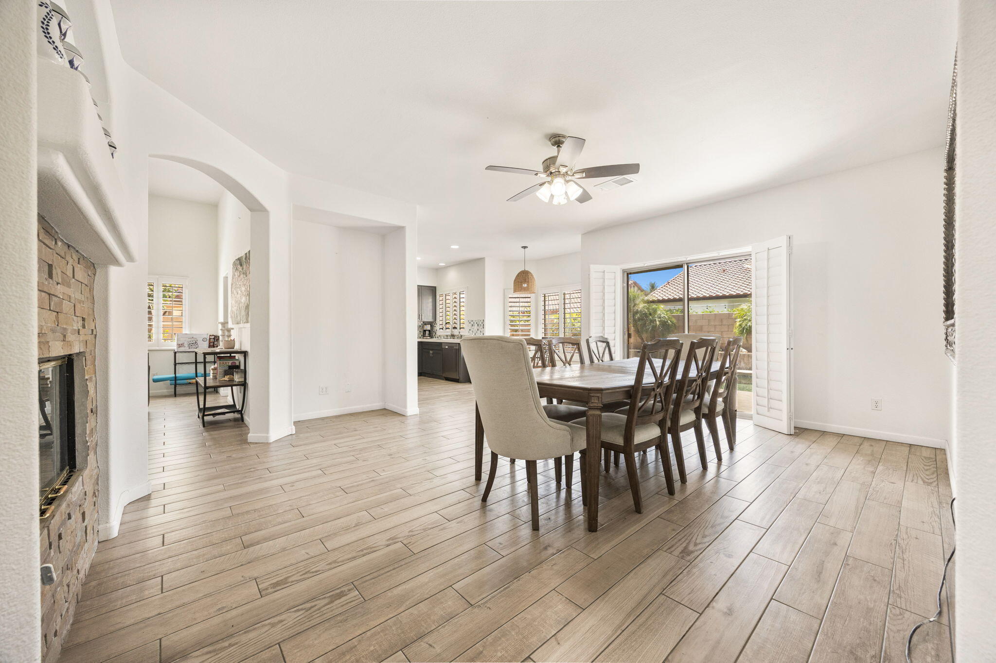 48701 Gibraltar Street Indio, CA 92201 - Photo 8 of 52 a view of a dining room with furniture and wooden floor