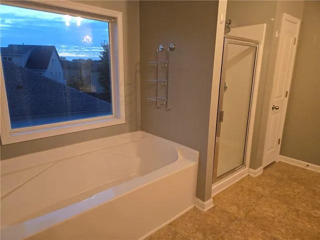a bathroom with a sink double vanity and a mirror