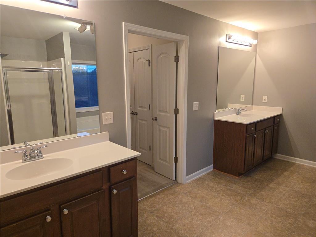 4613 Irish Red Court Union City, GA 30291 - Photo 14 of 15 a bathroom with a sink double vanity and a mirror