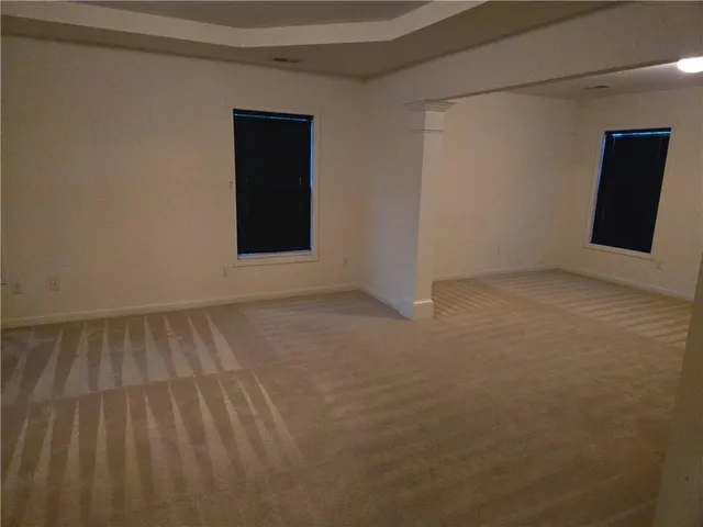 a view of an empty room and window