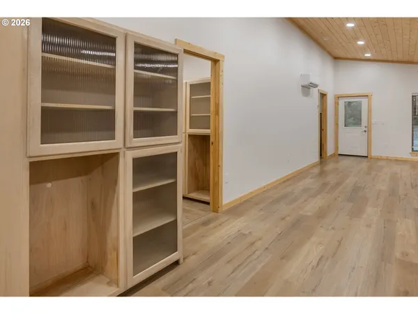 a view of an empty room with a closet