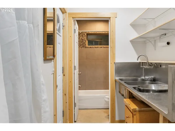 a kitchen with stainless steel appliances granite countertop a sink and dishwasher